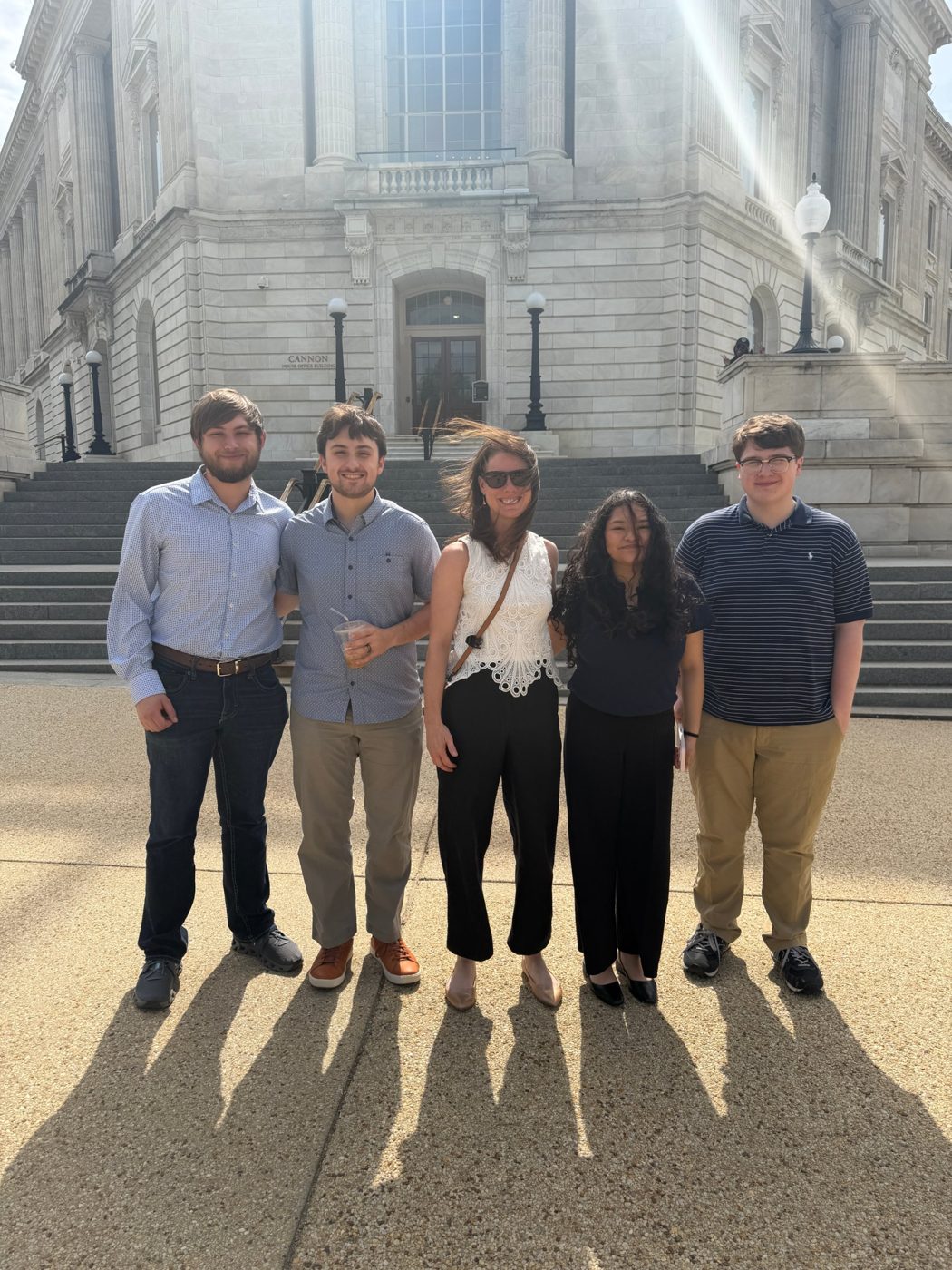Dr. Davis and four undergraduate researchers outside the Cannon House Office Building